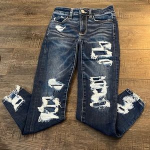 Dark blue patched ripped jeans